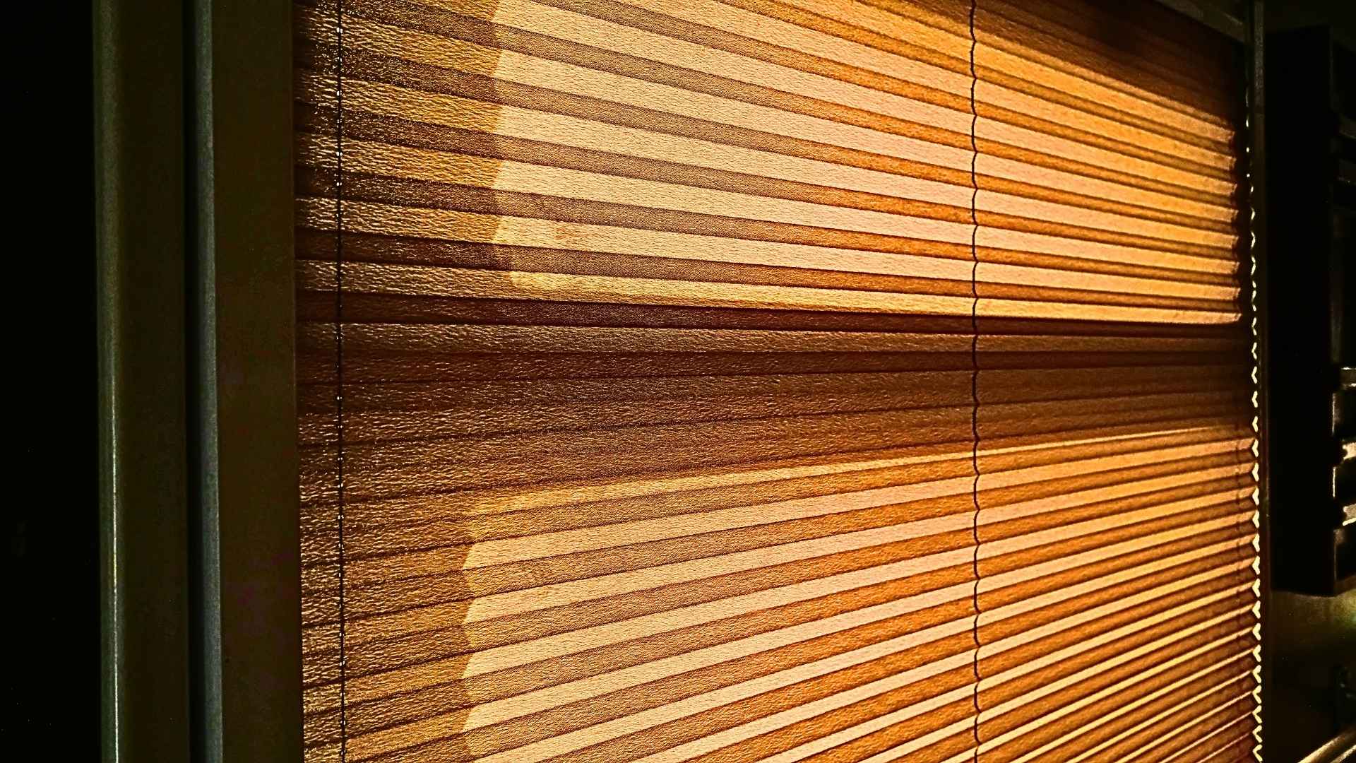 Picture of blinds drawn to make the room dark to signify financial time blindness.
